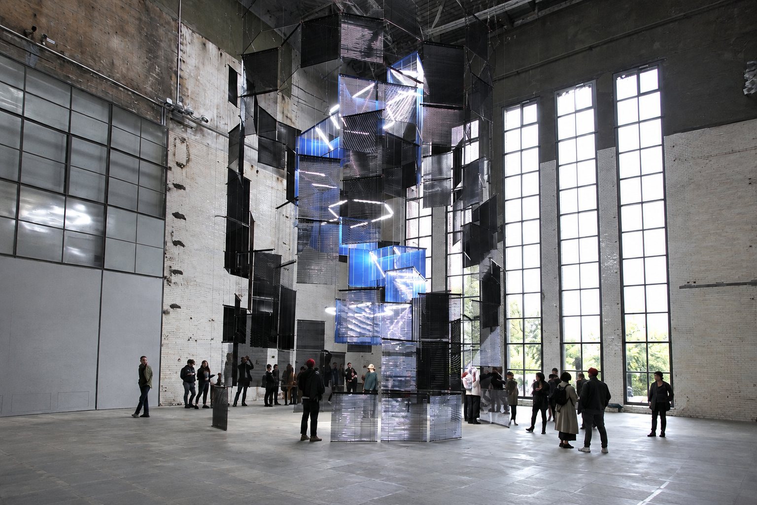 Exterior view of a Berlin contemporary art venue with visitors outside